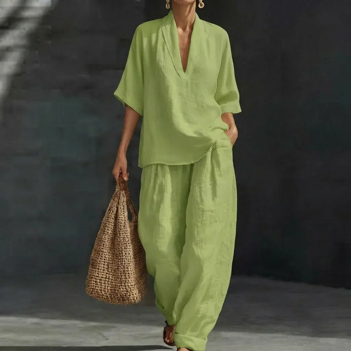 Comfortable women's relaxed fit two-piece set with V-neck top & wide-leg pants. Perfect for casual or travel.