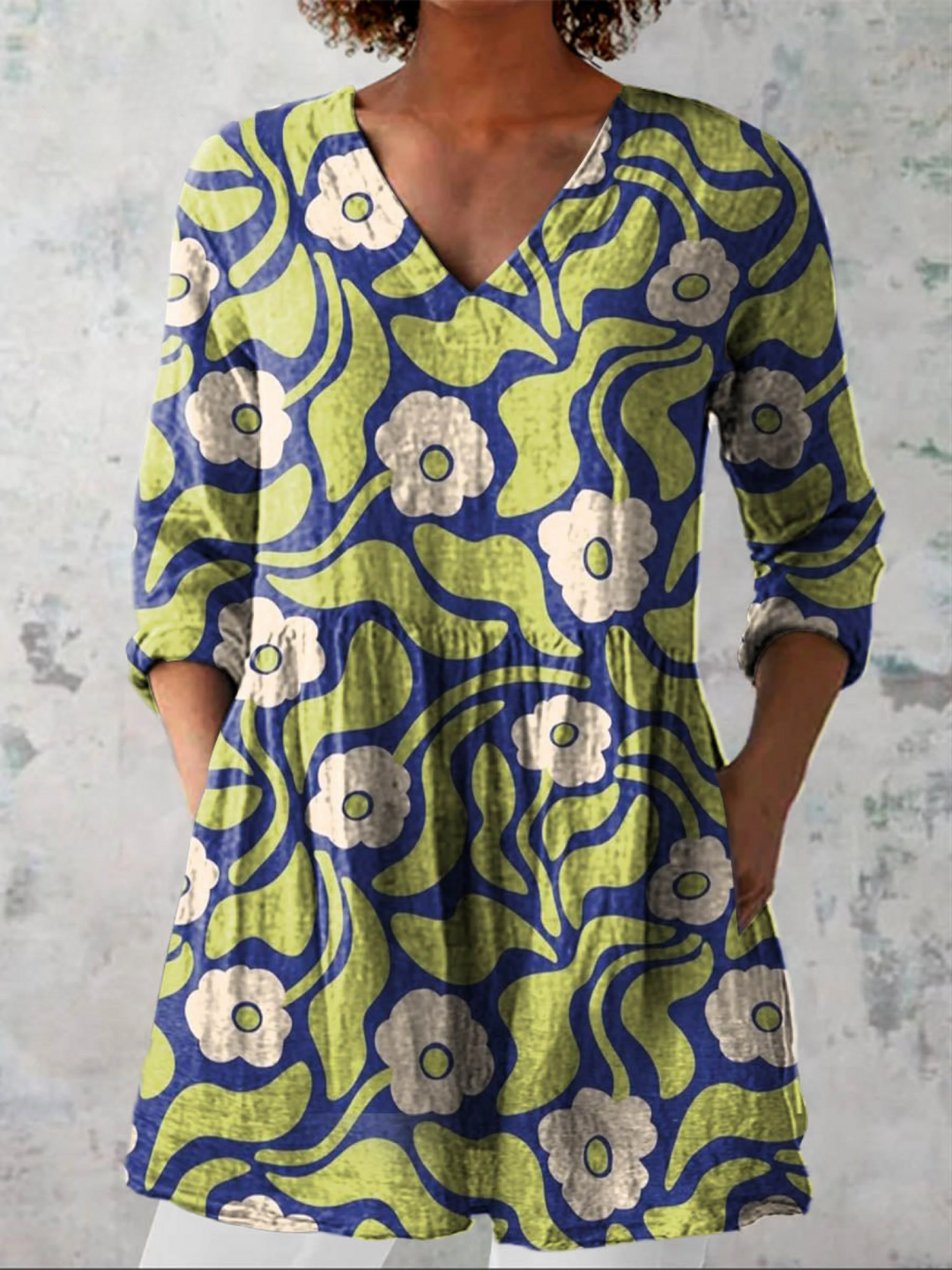 Women's relaxed V-neck tunic top with three-quarter sleeves & pockets, ideal for summer casual, beach, or travel.