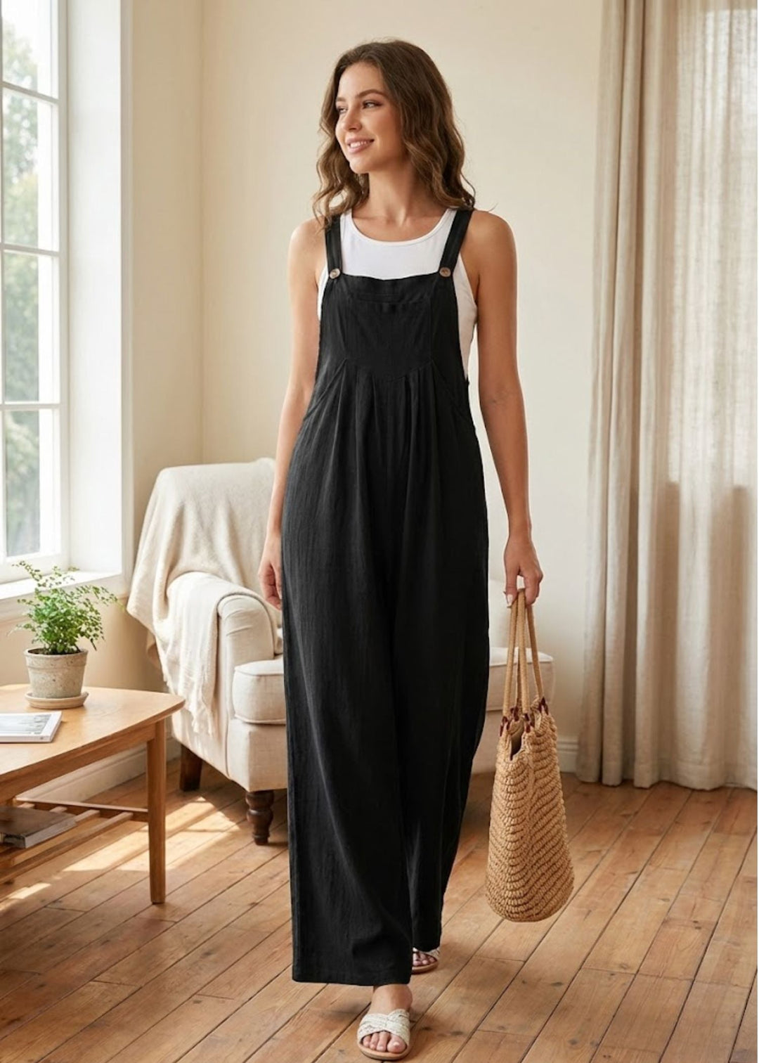 Women's relaxed wide leg jumpsuit, perfect for summer casual wear. Features adjustable straps & practical pockets.
