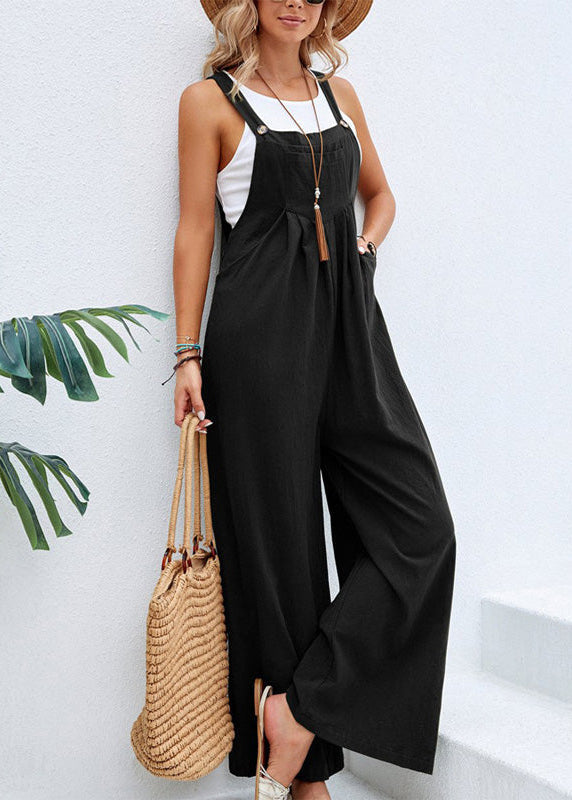 Relaxed women's wide leg jumpsuit with adjustable straps & pockets. Ideal casual summer one-piece outfit.