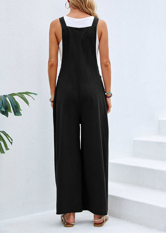 Bohemian women's wide leg jumpsuit, relaxed fit for summer. Features adjustable straps & spacious pockets.