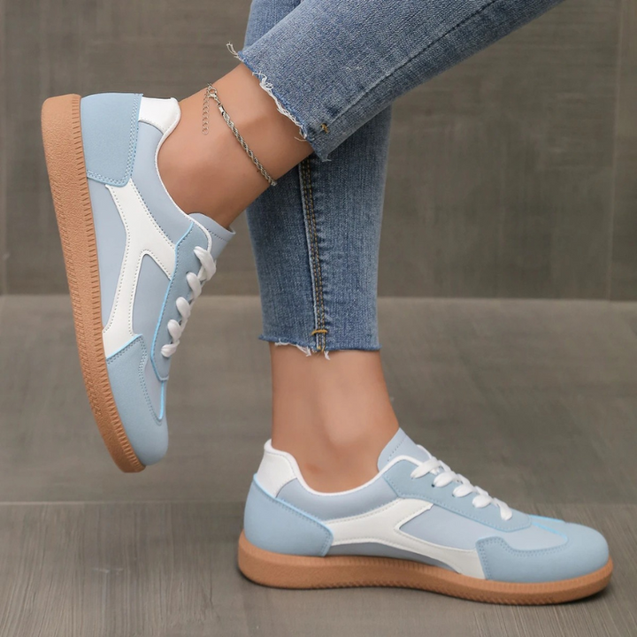 Classic women's fashion sneakers; low top design, retro aesthetic, and durable cushioned gum sole.