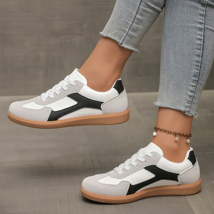 Enjoy retro style with these comfortable women's low top sneakers, featuring a soft cushioned gum sole.