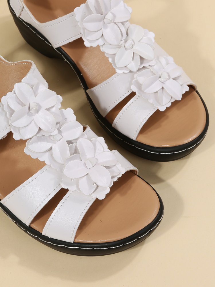 Peep-toe floral retro sandals for women, elegant and comfortable summer footwear.