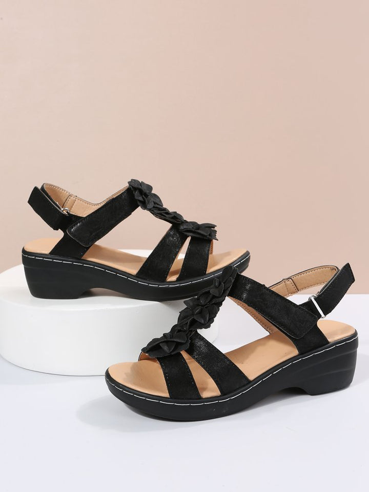 Stylish retro summer footwear for women, gladiator sandals with a comfortable wedge heel.