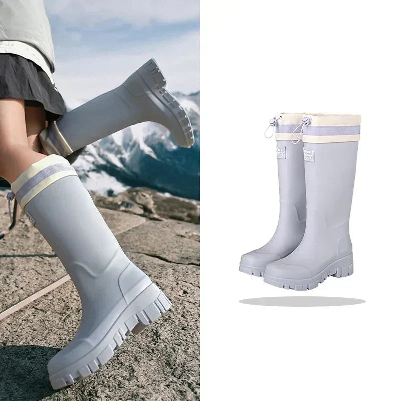 Close-up of anti-slip sole on women's retro waterproof rain boots, ensuring traction on wet autumn surfaces.