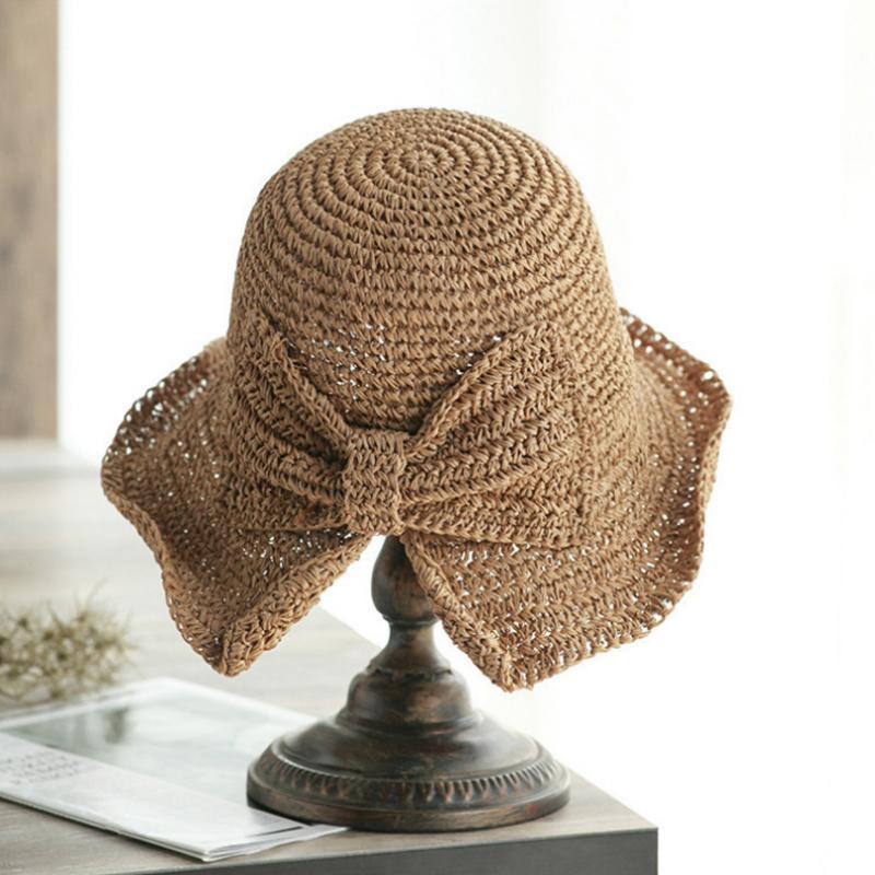 Women's retro wide-brim sun hat with elegant bow for UV protection and beachwear