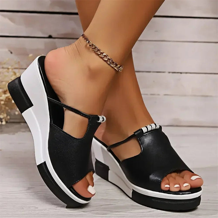 Fashionable women's slide sandals with rhinestone embellishments, a chic wedge heel, and comfortable platform.