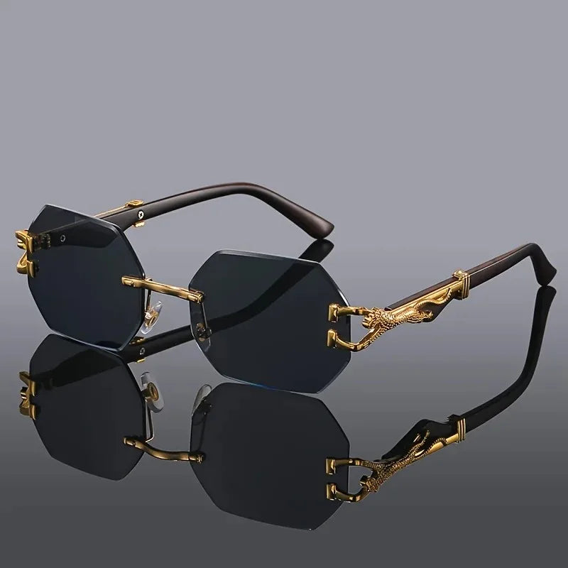 Rimless geometric women's sunglasses with sculptural gold panther. Fashionable & offers UV protection.