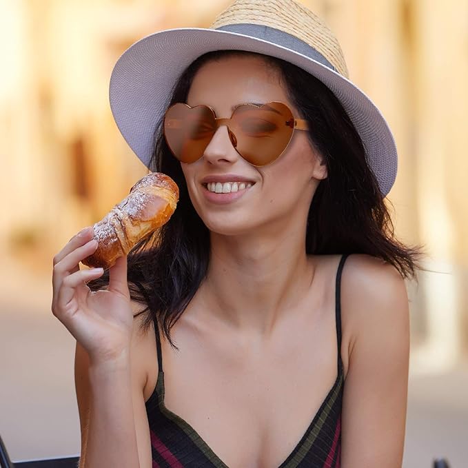 Heart-shaped transparent rimless sunglasses for women, a sleek and modern design.