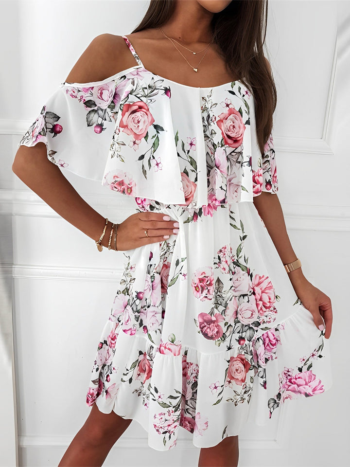 Women's romantic floral cold shoulder mini dress with ruffles, perfect for summer parties and events.