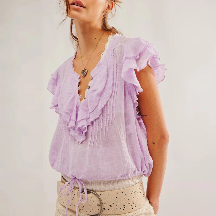 Chic women's crop top with delicate ruffles, perfect for summer fashion and everyday wear.