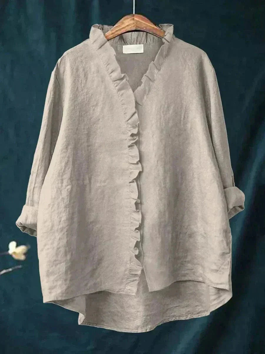 Relaxed fit women's summer top with delicate ruffle neck. Casual yet elegant, ideal for warm weather fashion.