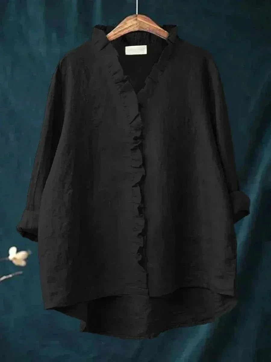 Women's lightweight ruffle neck blouse, relaxed fit summer apparel. Elegant casual top for any occasion.