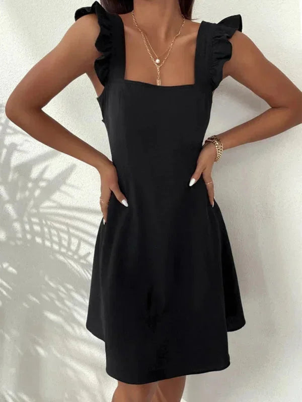 Close-up of the elegant bow back detail on a Women's Ruffle Strap A-Line Mini Dress.