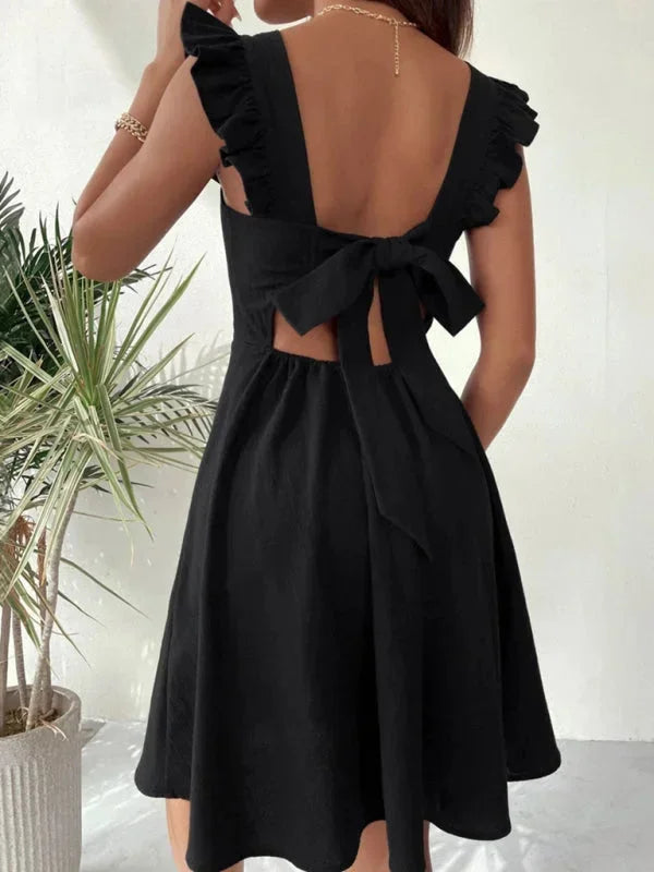 Model wearing a flattering Ruffle Strap A-line Mini Dress, perfect for stylish summer looks.