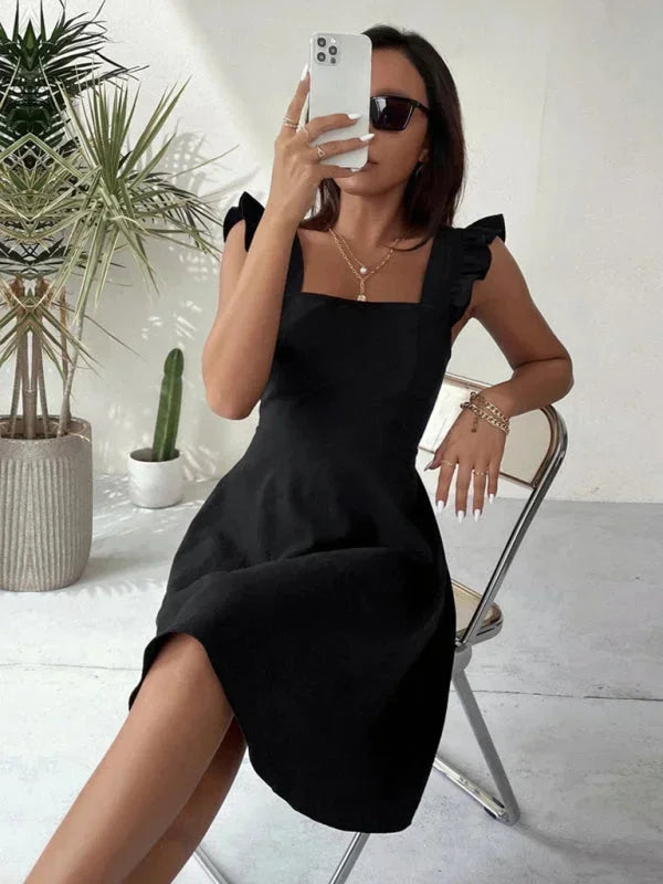 Playful Ruffle Strap A-line mini dress for women, with a unique bow back feature for fun style.