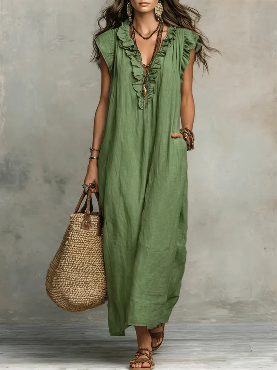 Flowy bohemian ruffle maxi dress for women, featuring a V-neck, flutter sleeves & pockets. Perfect vacation wear.