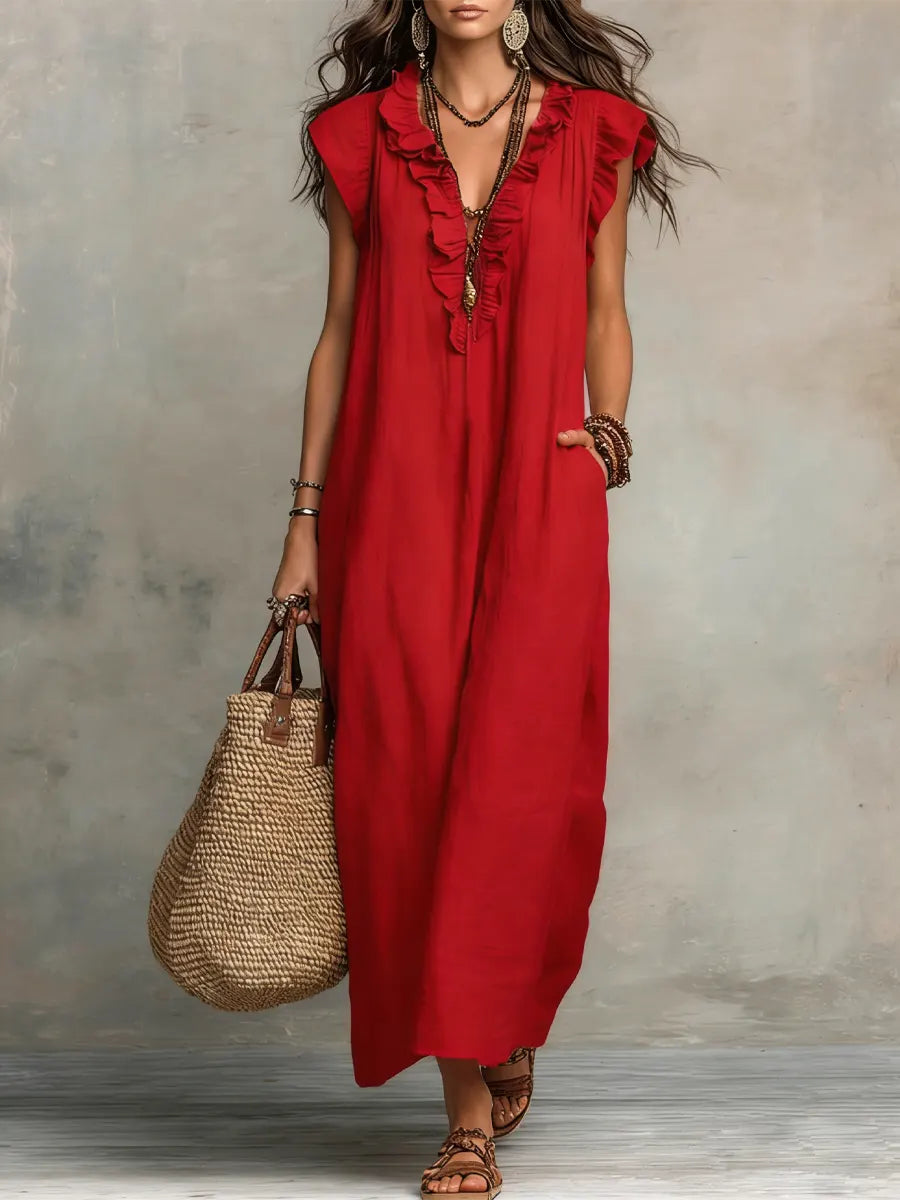 Elegant V-neck ruffle maxi dress with airy flutter sleeves and convenient pockets. Great for resort or summer.