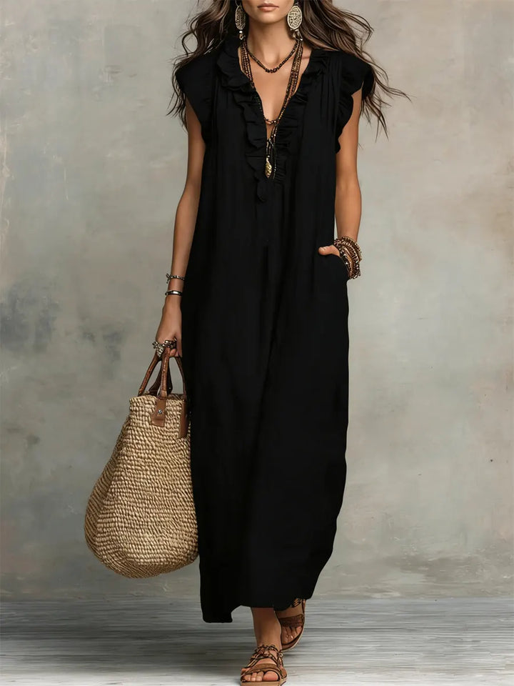 Bohemian style ruffle V-neck maxi dress for women with flutter sleeves & pockets. Flowy and comfortable resort wear.