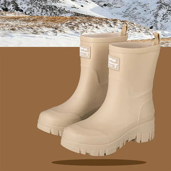 Comfortable women's black Chelsea rain boots with robust block heel & grip tread.