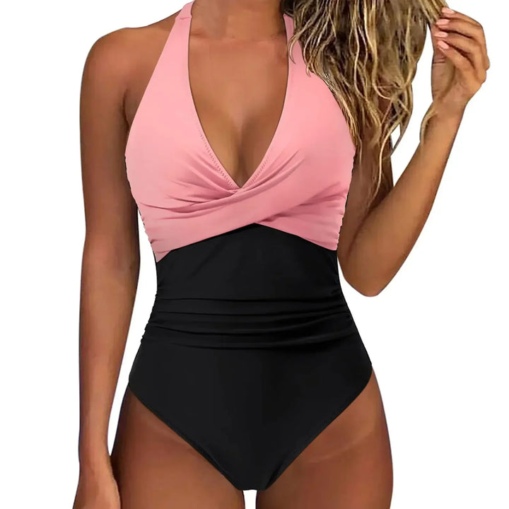 Embrace vacation style with this women's sculpting one piece swimsuit and its chic halter neck.