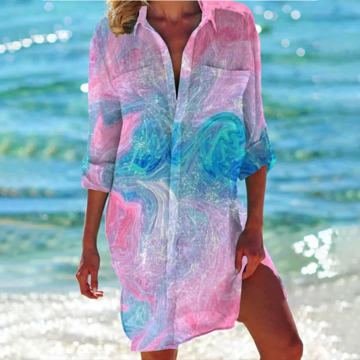 Chic women's seashell print beach cover-up. 3/4 sleeve shirt dress, perfect for resort, pool, and summer.