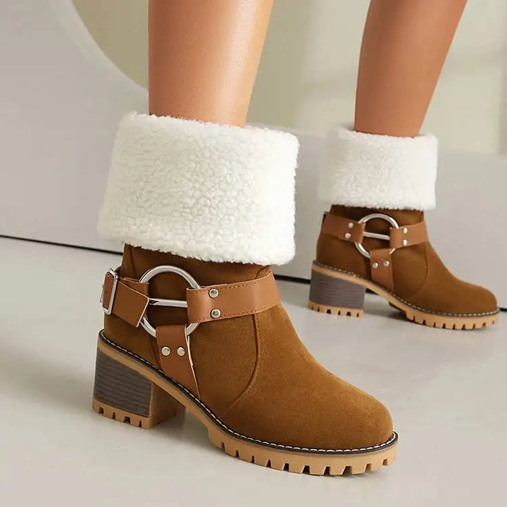 Side view of women's ankle boot, showcasing ring detail and block heel