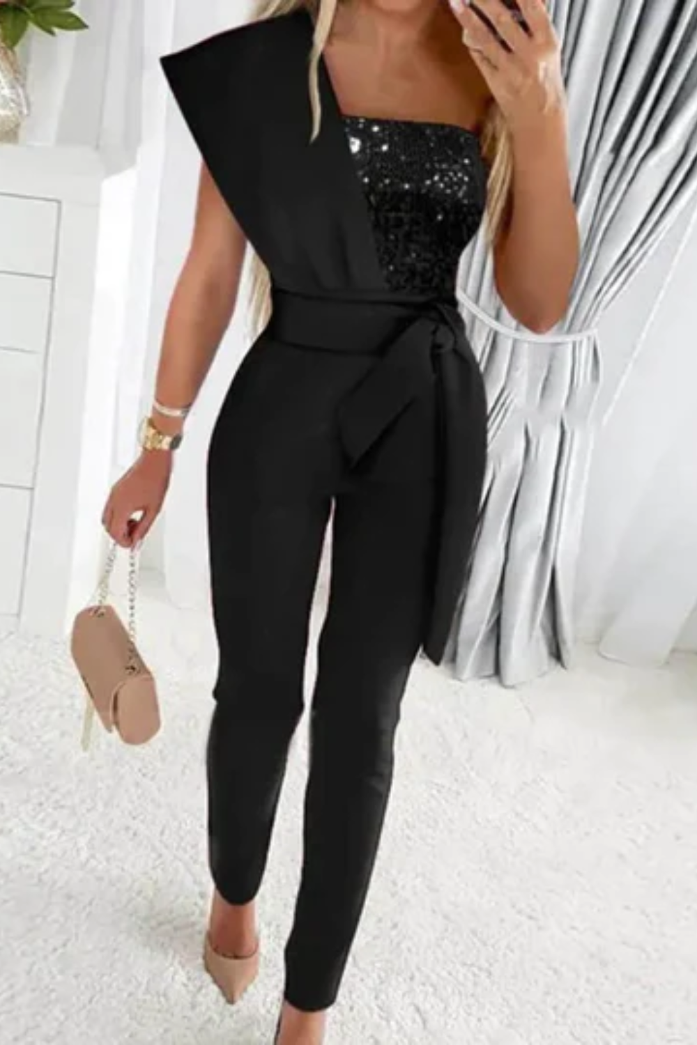 Shimmering women's sequin jumpsuit. Chic, comfortable one-piece for formal occasions and elegant celebrations.