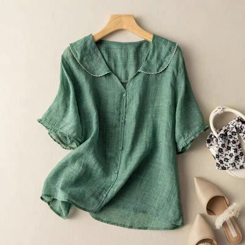 Women's short sleeve blouse with delicate scalloped collar and button-front. Relaxed fit, perfect for spring/summer.