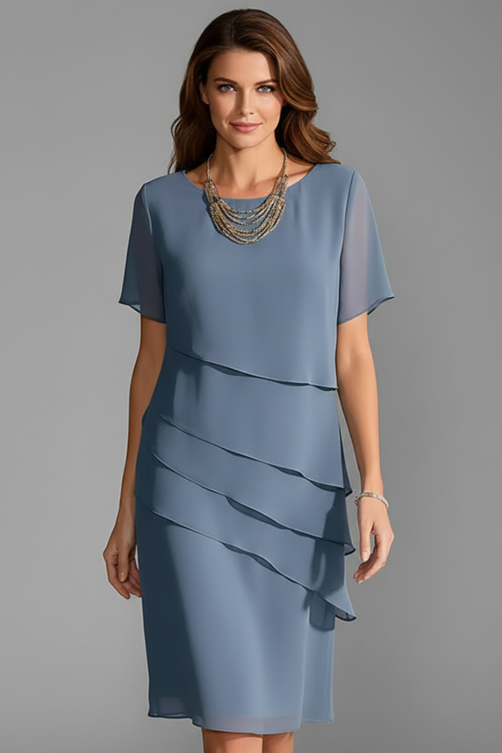 Modern women's casual dress with short sleeves, layered front. Comfortable, straight fit, knee-length for daily wear.