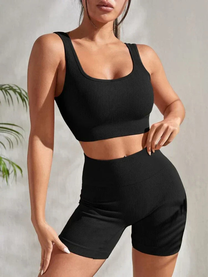 Detail of Sienna women's activewear set: breathable sports top & high-waisted workout shorts.