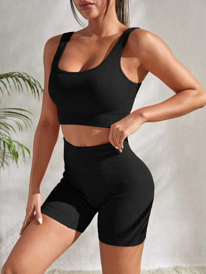 Back view of woman in Sienna 2-piece gym outfit. Athletic sports top & flattering workout shorts.