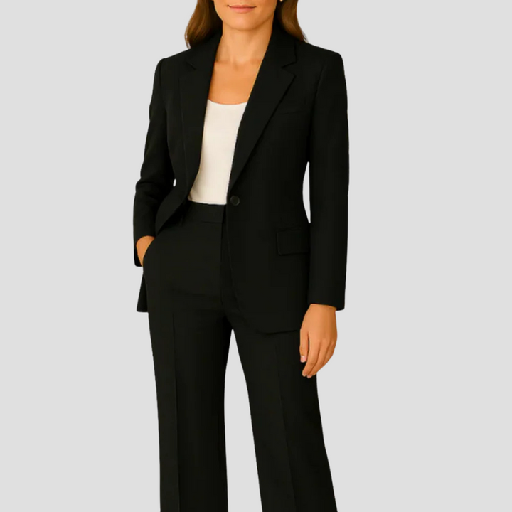Modern women's single-breasted tailored pant suit. A classic ensemble for professional work fashion.