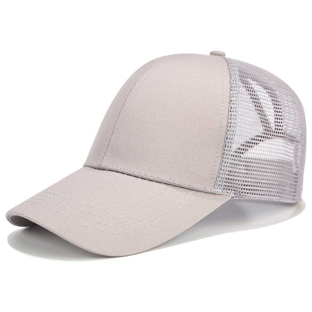 Women's athletic SkyShield baseball cap for high ponytails, offering sun protection for outdoor sports.
