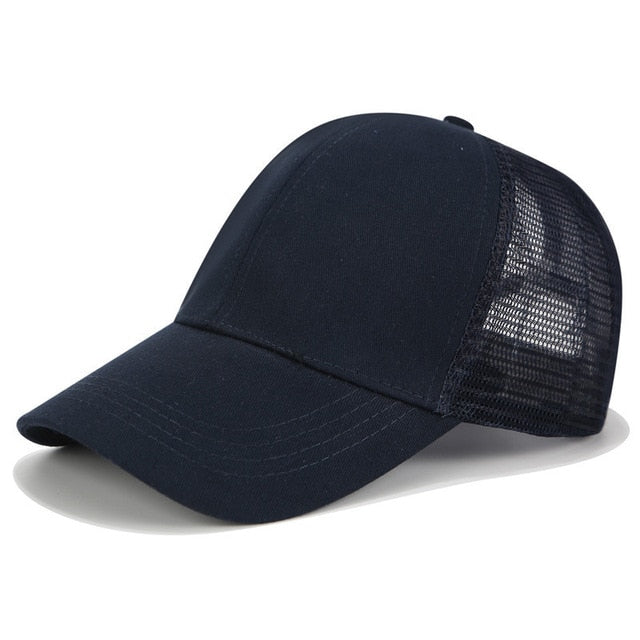 Women's SkyShield high bun baseball cap, adjustable for active outdoor sun protection and comfort.