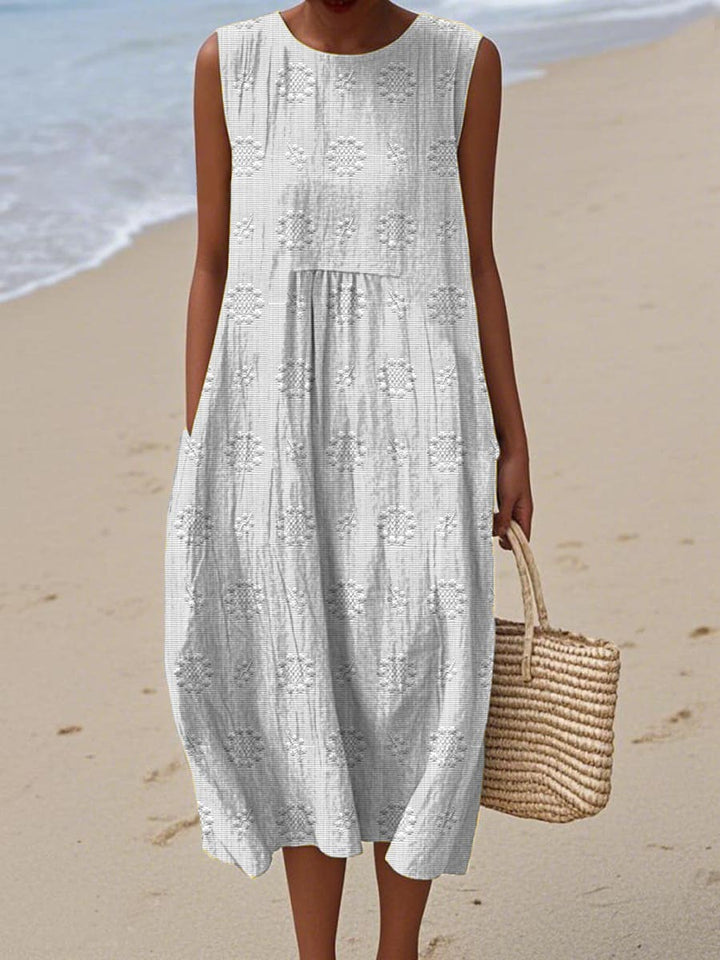 Plus size women's sleeveless midi dress, round neck. Elegant casual flowy style for comfortable summer fashion.