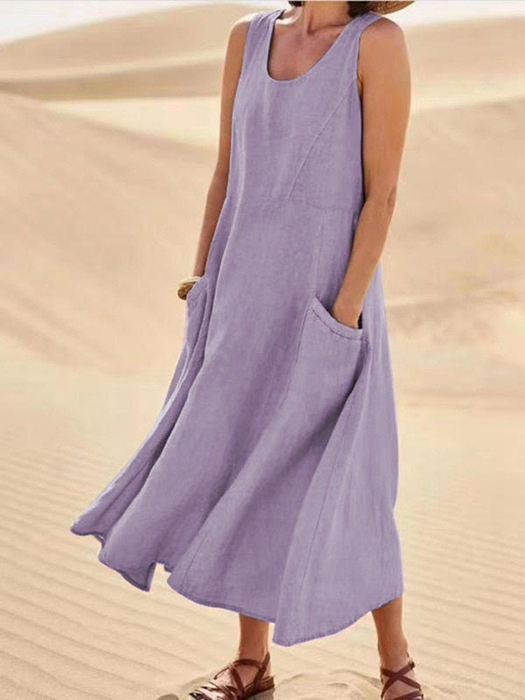 Relaxed fit women's sleeveless scoop-neck midi dress with pockets, great for beachwear & versatility.