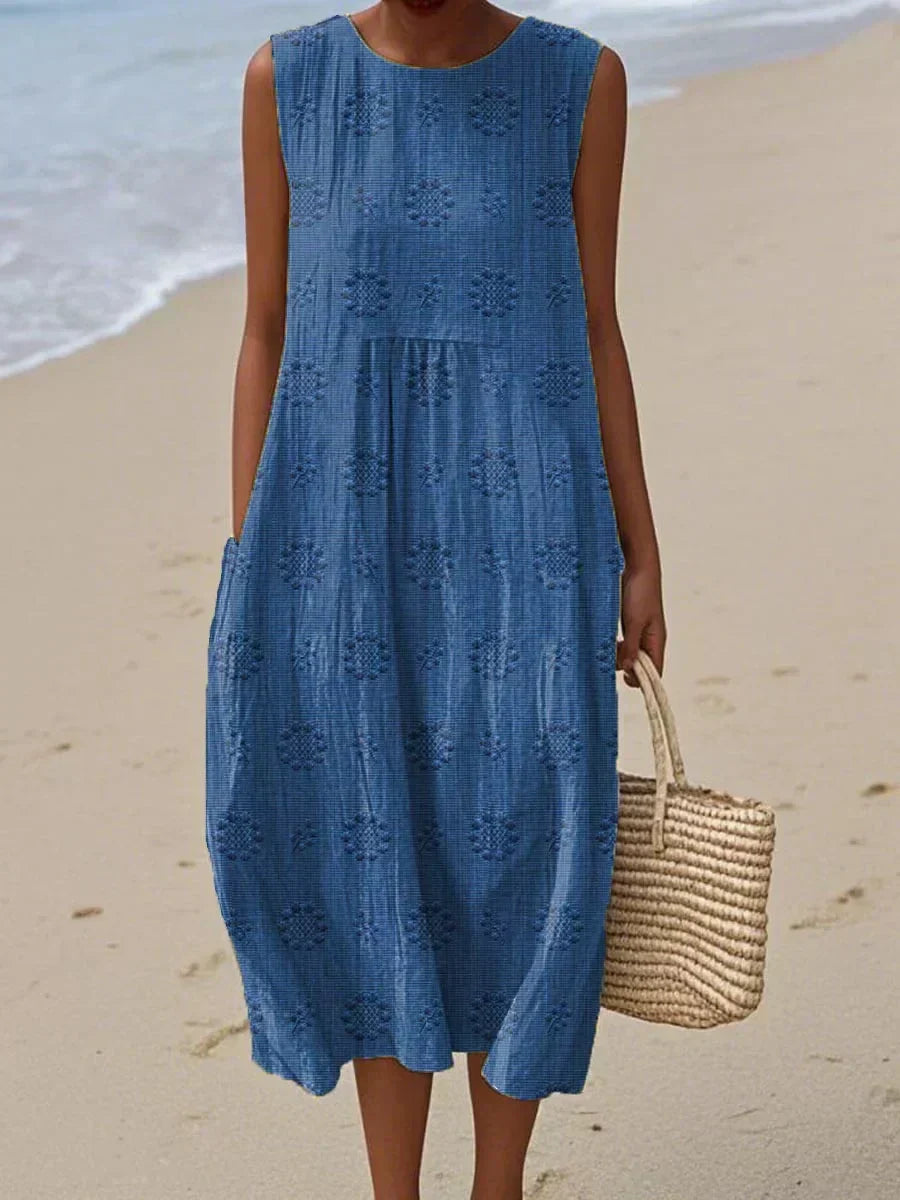 Flowy sleeveless midi summer dress for women, offering effortless style & comfort with pockets.