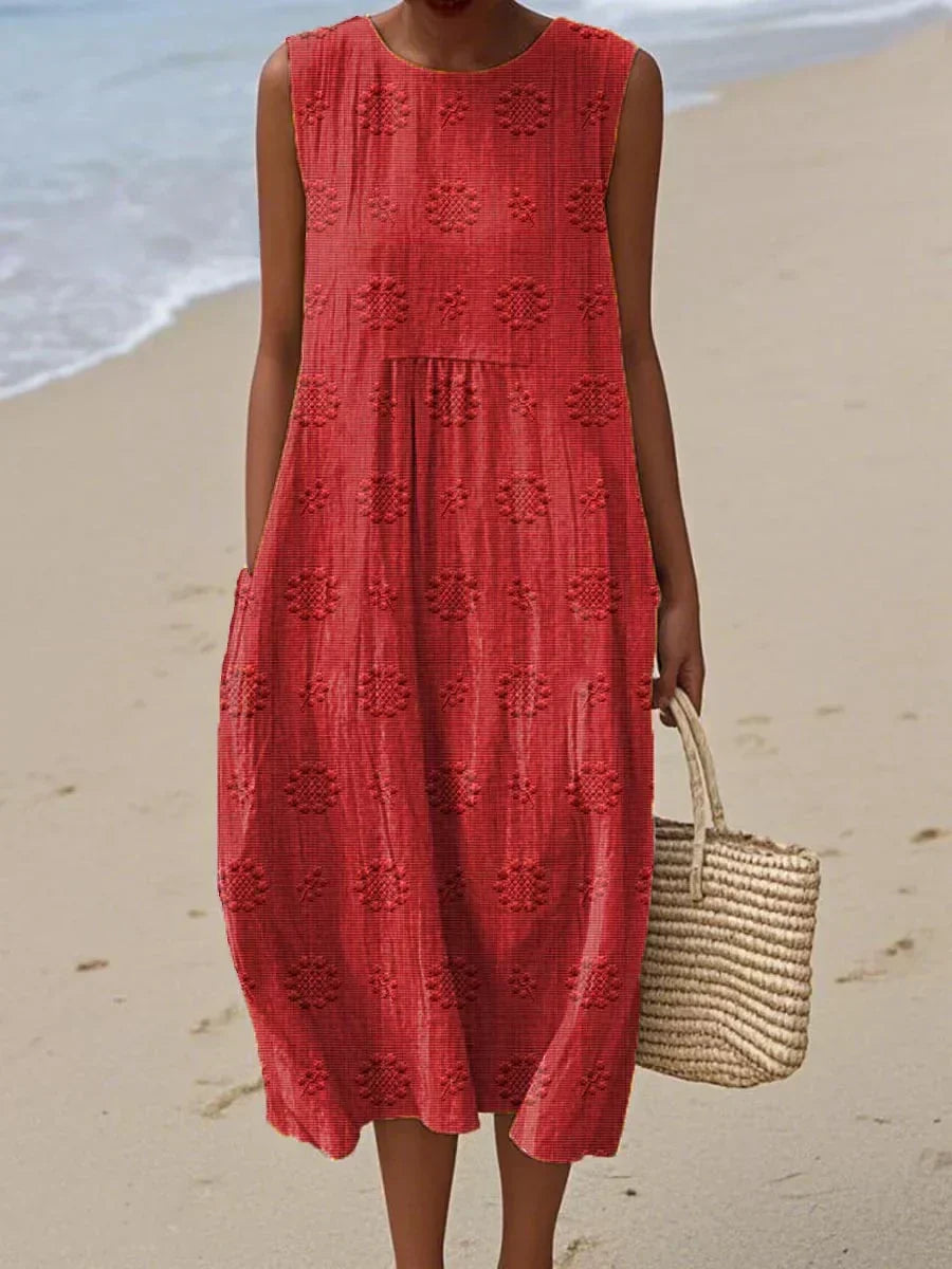 Chic sleeveless summer midi dress for women, featuring a flowy design & practical pockets.