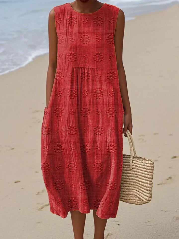 Chic sleeveless summer midi dress for women, featuring a flowy design & practical pockets.