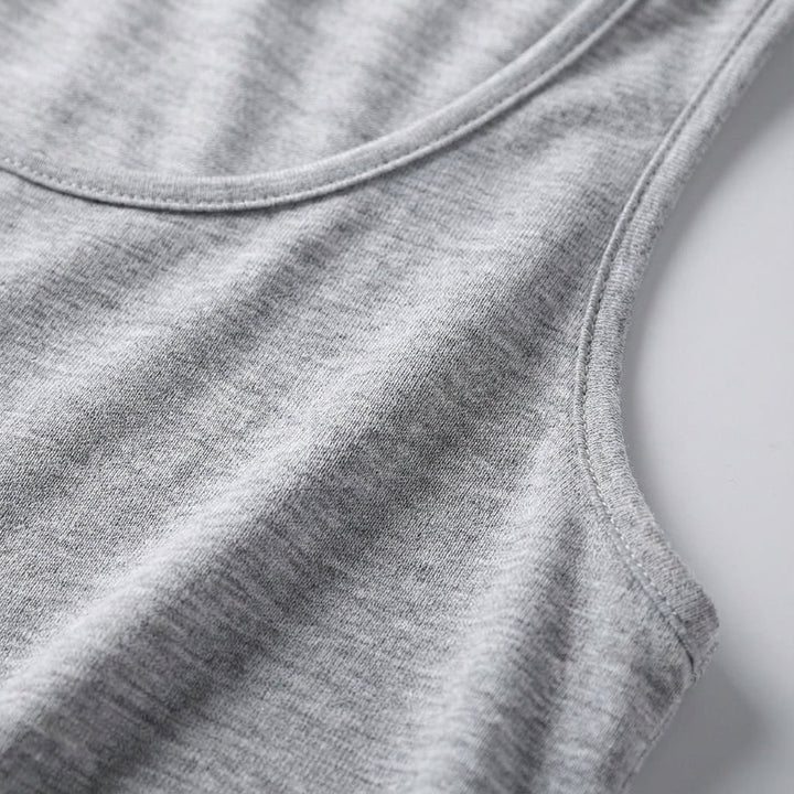 Comfortable women's workout top, sleeveless design for active women. Ideal fitness apparel for training sessions.