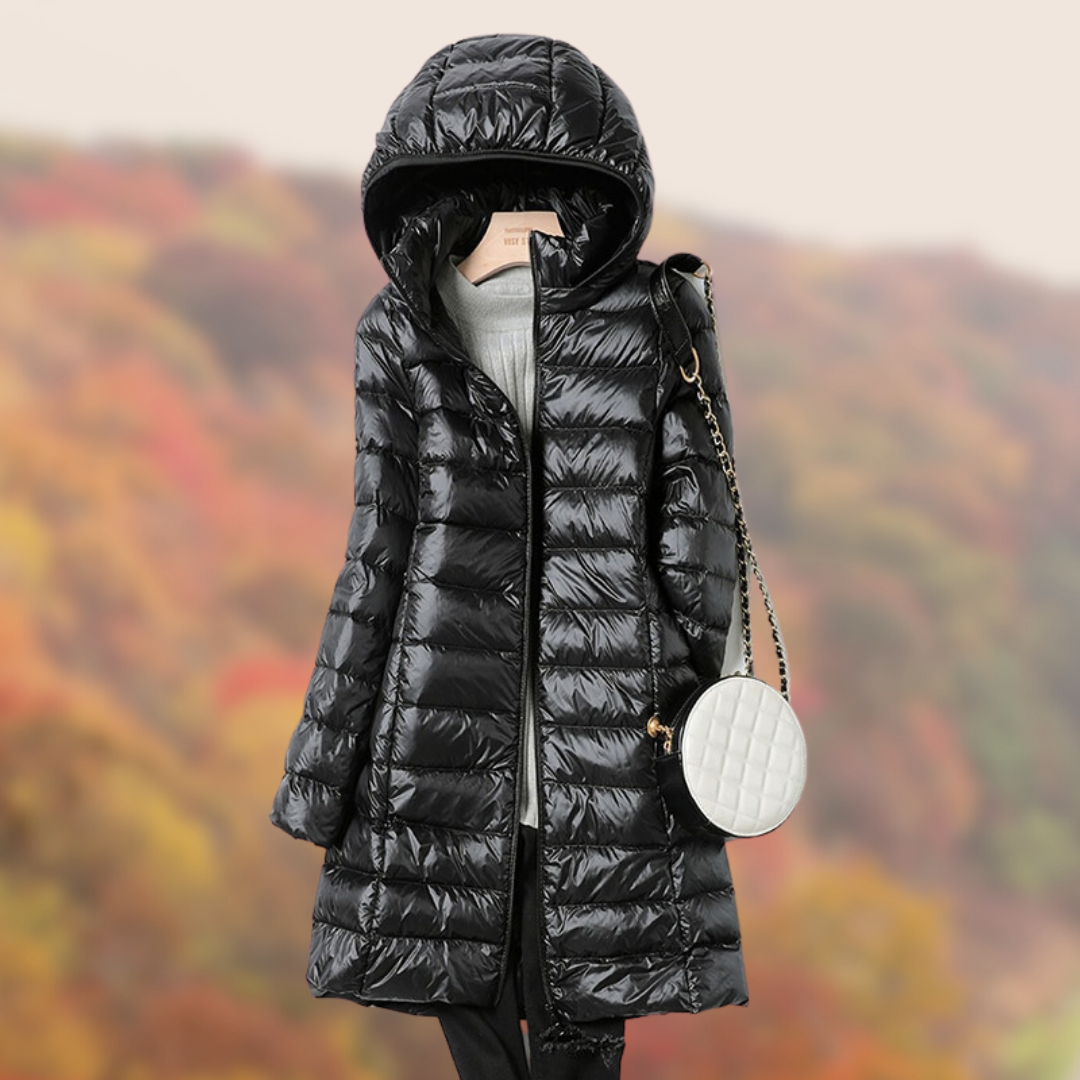 Lightweight women's puffer jacket with hood, showcasing a flattering slim fit design