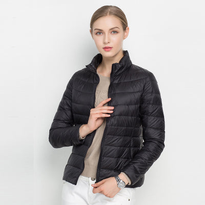Warm women's puffer winter coat, slim fit, in a vibrant red, adding a pop of color to cold weather fashion.