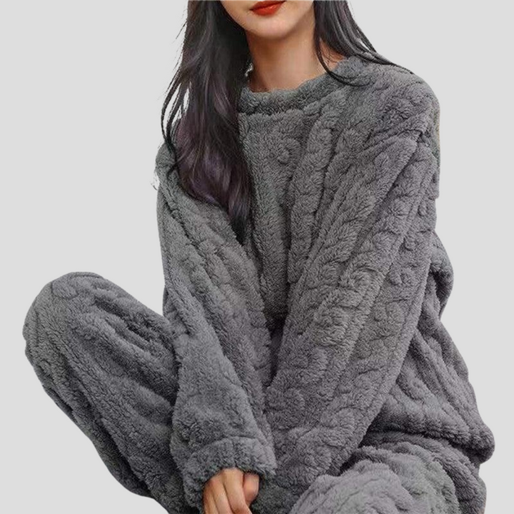 Luxurious women's fleece pajama set. Ultra-soft fabric for ultimate comfort & warmth during winter sleep.