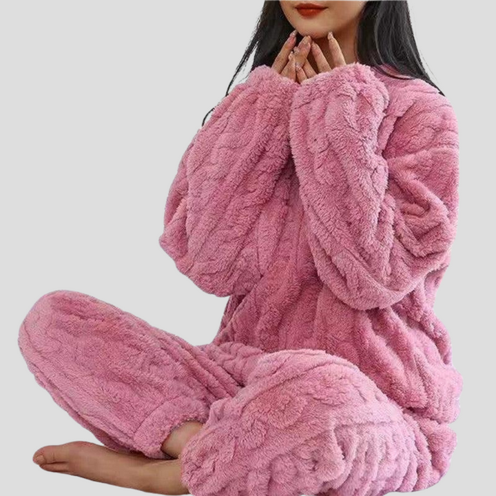 Close-up of soft fleece fabric on women's winter pajama set, showcasing cozy texture & warmth.