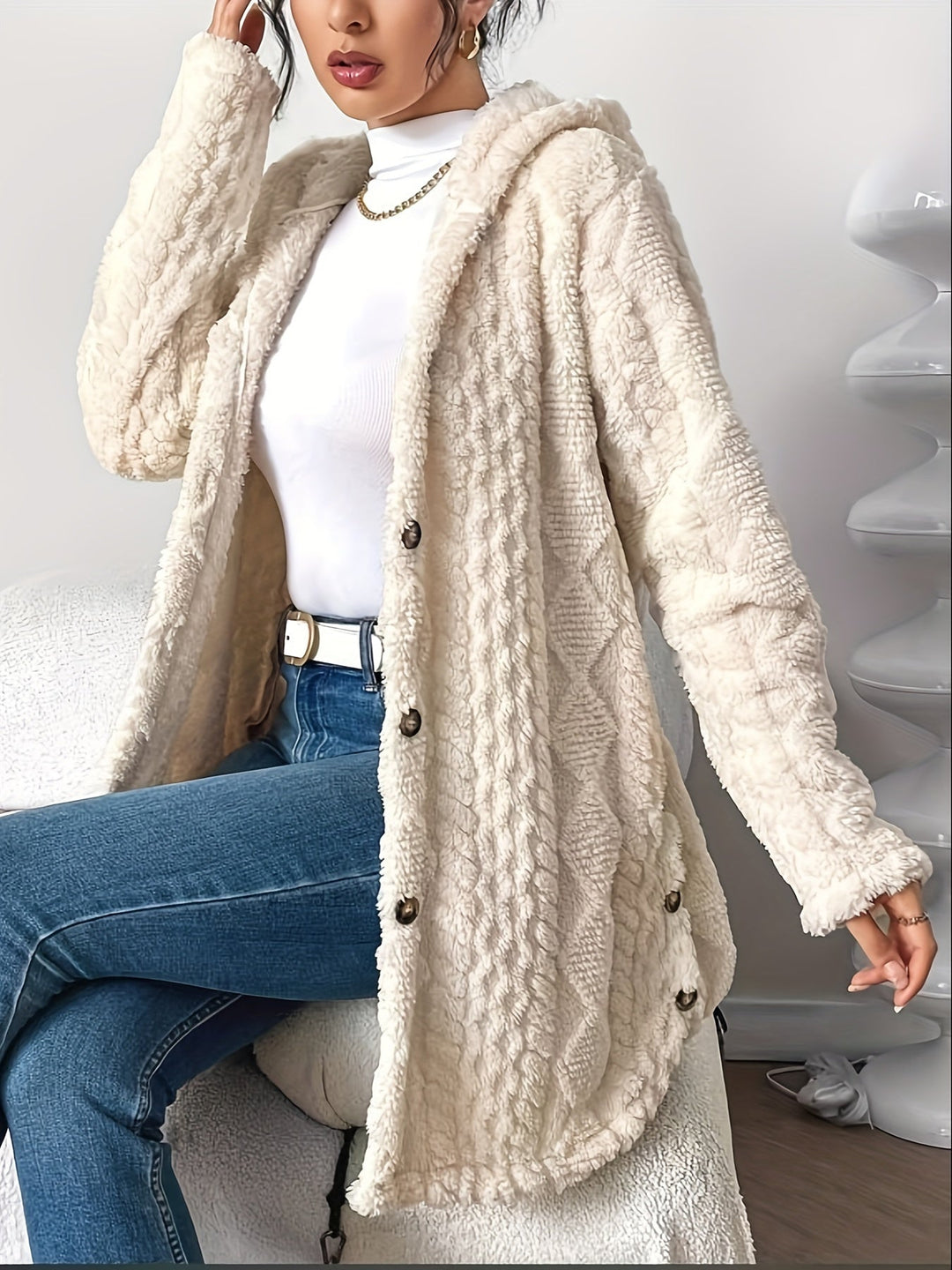 Chic women's long hooded cardigan, offering cozy warmth and effortless style for any day.
