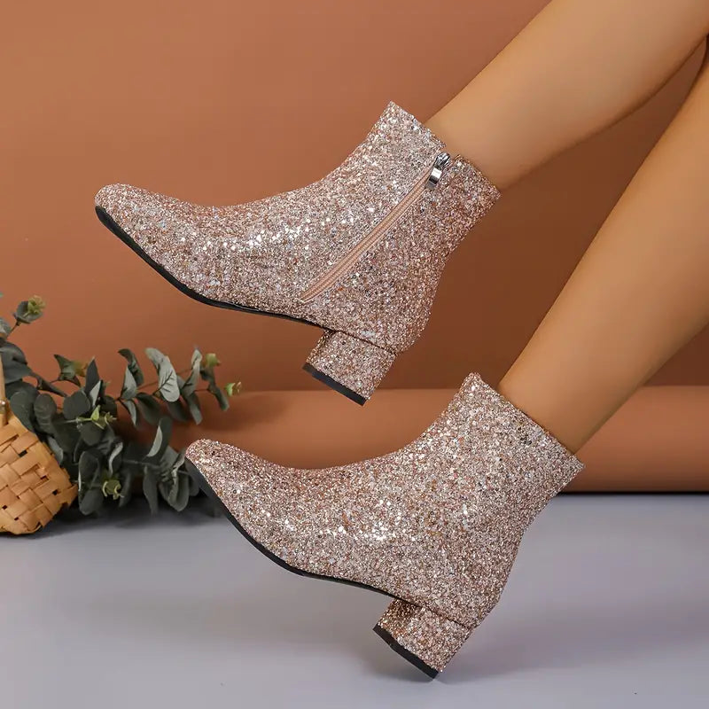 Stylish women's glitter ankle boots with a comfortable stable heel. Fashionable sparkling footwear.