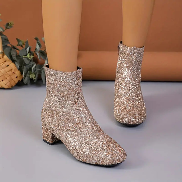 Dazzling women's glitter ankle boots featuring a sturdy stable heel. Ideal for evening wear & glamorous events.