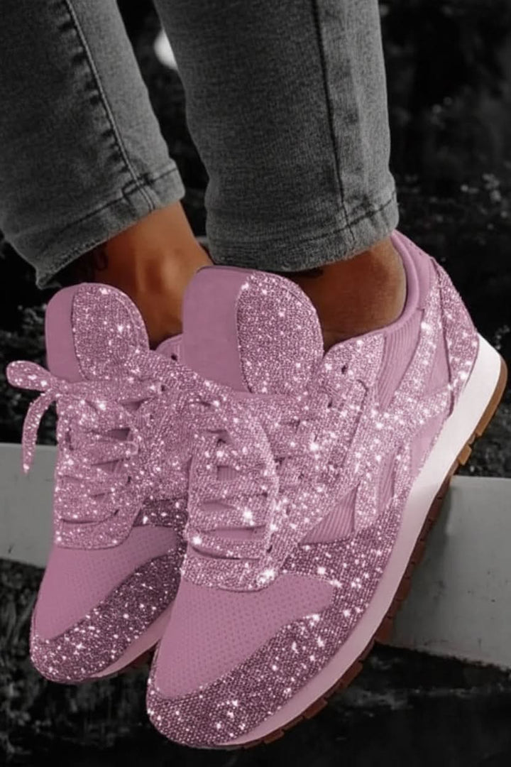 Angled shot of women's sparkling fashion sneakers, blending glitter style with comfy athleisure.